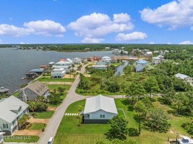 Welcome to 129 Sweet Bay Dr., a stunning coastal retreat nestled on Pass Christian Isles Golf Club in Mississippi - for sale on GolfHomes.com, golf home, golf lot