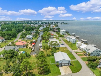 Welcome to 129 Sweet Bay Dr., a stunning coastal retreat nestled on Pass Christian Isles Golf Club in Mississippi - for sale on GolfHomes.com, golf home, golf lot