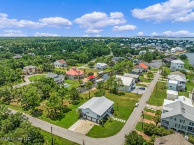 Welcome to 129 Sweet Bay Dr., a stunning coastal retreat nestled on Pass Christian Isles Golf Club in Mississippi - for sale on GolfHomes.com, golf home, golf lot