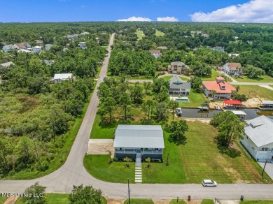 Welcome to 129 Sweet Bay Dr., a stunning coastal retreat nestled on Pass Christian Isles Golf Club in Mississippi - for sale on GolfHomes.com, golf home, golf lot