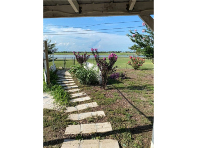 Discover the hidden treasure on a serene golf course with a on Oso Beach Municipal Golf Course in Texas - for sale on GolfHomes.com, golf home, golf lot