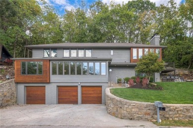 Step inside this stunning lakefront home and just say *wow* on Lake Quivira Country Club in Kansas - for sale on GolfHomes.com, golf home, golf lot