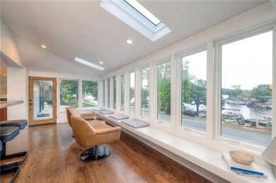 Step inside this stunning lakefront home and just say *wow* on Lake Quivira Country Club in Kansas - for sale on GolfHomes.com, golf home, golf lot