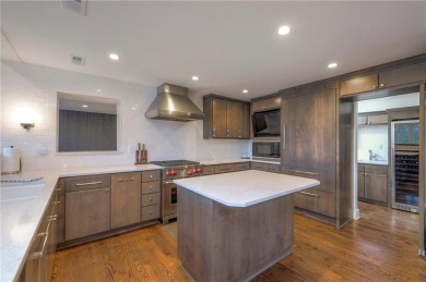 Step inside this stunning lakefront home and just say *wow* on Lake Quivira Country Club in Kansas - for sale on GolfHomes.com, golf home, golf lot