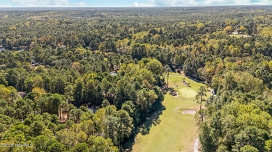 This golf front oasis is located on the picturesque 12th hole of on Seven Lakes Country Club in North Carolina - for sale on GolfHomes.com, golf home, golf lot