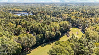 This golf front oasis is located on the picturesque 12th hole of on Seven Lakes Country Club in North Carolina - for sale on GolfHomes.com, golf home, golf lot