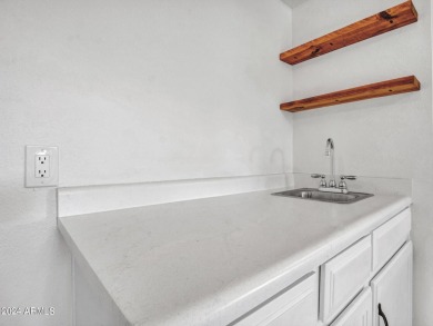 Step into this welcoming single-level townhome nestled in the on Bellaire Golf Club in Arizona - for sale on GolfHomes.com, golf home, golf lot