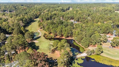 This golf front oasis is located on the picturesque 12th hole of on Seven Lakes Country Club in North Carolina - for sale on GolfHomes.com, golf home, golf lot