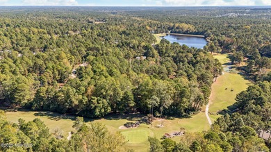 This golf front oasis is located on the picturesque 12th hole of on Seven Lakes Country Club in North Carolina - for sale on GolfHomes.com, golf home, golf lot