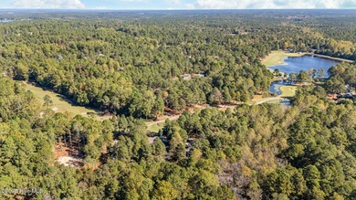 This golf front oasis is located on the picturesque 12th hole of on Seven Lakes Country Club in North Carolina - for sale on GolfHomes.com, golf home, golf lot