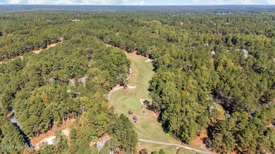 This golf front oasis is located on the picturesque 12th hole of on Seven Lakes Country Club in North Carolina - for sale on GolfHomes.com, golf home, golf lot