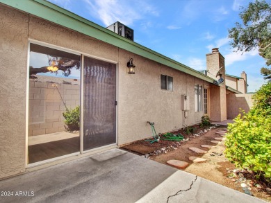 Step into this welcoming single-level townhome nestled in the on Bellaire Golf Club in Arizona - for sale on GolfHomes.com, golf home, golf lot