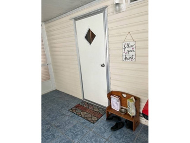 Welcome to your adorable getaway home in The Hamptons Golf and on Hamptons Golf Club in Florida - for sale on GolfHomes.com, golf home, golf lot