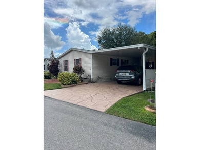 Welcome to your adorable getaway home in The Hamptons Golf and on Hamptons Golf Club in Florida - for sale on GolfHomes.com, golf home, golf lot