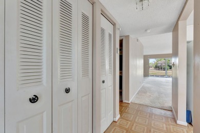 Enjoy peaceful living in this charming 2-bedroom, 2-bathroom on Inverrary Country Club in Florida - for sale on GolfHomes.com, golf home, golf lot
