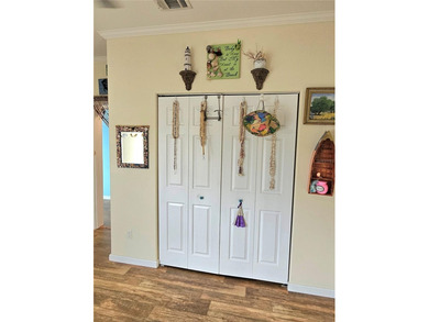 Welcome to a cheerful and inviting home tucked within the on Saint Andrews South Golf Club in Florida - for sale on GolfHomes.com, golf home, golf lot