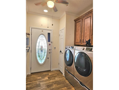 Welcome to a cheerful and inviting home tucked within the on Saint Andrews South Golf Club in Florida - for sale on GolfHomes.com, golf home, golf lot