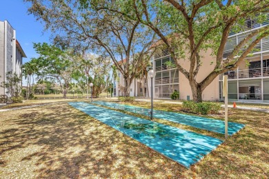Enjoy peaceful living in this charming 2-bedroom, 2-bathroom on Inverrary Country Club in Florida - for sale on GolfHomes.com, golf home, golf lot