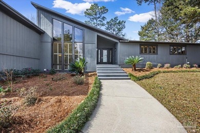 The stunning architecture of this home is likely the Masterpiece on Scenic Hills Country Club in Florida - for sale on GolfHomes.com, golf home, golf lot