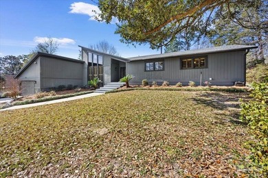 The stunning architecture of this home is likely the Masterpiece on Scenic Hills Country Club in Florida - for sale on GolfHomes.com, golf home, golf lot