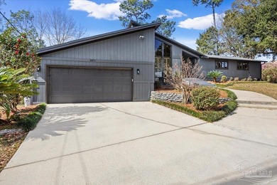 The stunning architecture of this home is likely the Masterpiece on Scenic Hills Country Club in Florida - for sale on GolfHomes.com, golf home, golf lot