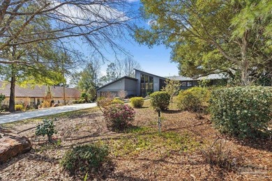 The stunning architecture of this home is likely the Masterpiece on Scenic Hills Country Club in Florida - for sale on GolfHomes.com, golf home, golf lot