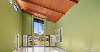 The stunning architecture of this home is likely the Masterpiece on Scenic Hills Country Club in Florida - for sale on GolfHomes.com, golf home, golf lot