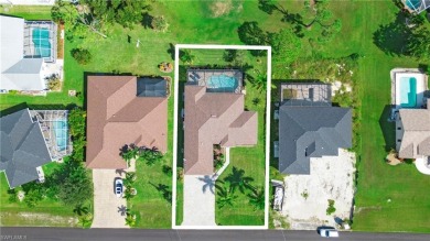 This exceptional pool home situated on the Coral Oaks Golf on Coral Oaks Golf Course in Florida - for sale on GolfHomes.com, golf home, golf lot