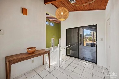 The stunning architecture of this home is likely the Masterpiece on Scenic Hills Country Club in Florida - for sale on GolfHomes.com, golf home, golf lot