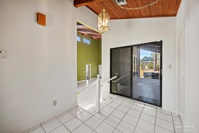 The stunning architecture of this home is likely the Masterpiece on Scenic Hills Country Club in Florida - for sale on GolfHomes.com, golf home, golf lot