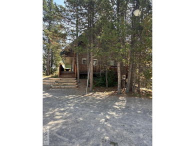 This big beautiful home has been used as a rental and has  made on Island Park Village Resort Golf Course in Idaho - for sale on GolfHomes.com, golf home, golf lot