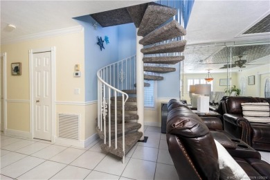 This residence boasts a spacious, open-concept design, perfectly on Island Dunes Country Club in Florida - for sale on GolfHomes.com, golf home, golf lot