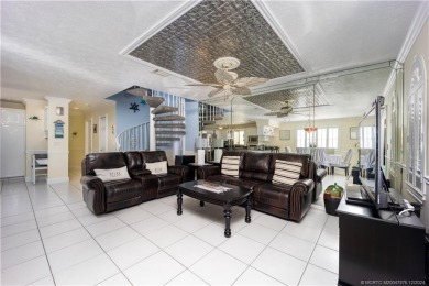 This residence boasts a spacious, open-concept design, perfectly on Island Dunes Country Club in Florida - for sale on GolfHomes.com, golf home, golf lot