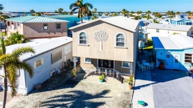 This residence boasts a spacious, open-concept design, perfectly on Island Dunes Country Club in Florida - for sale on GolfHomes.com, golf home, golf lot