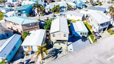 This residence boasts a spacious, open-concept design, perfectly on Island Dunes Country Club in Florida - for sale on GolfHomes.com, golf home, golf lot