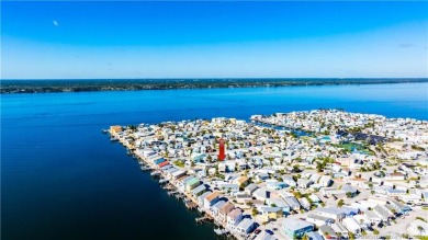 This residence boasts a spacious, open-concept design, perfectly on Island Dunes Country Club in Florida - for sale on GolfHomes.com, golf home, golf lot