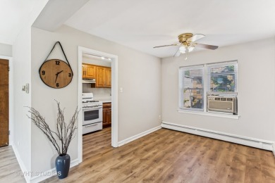 Welcome home to this desirable second floor corner unit drenched on Robert Black Golf Course in Illinois - for sale on GolfHomes.com, golf home, golf lot