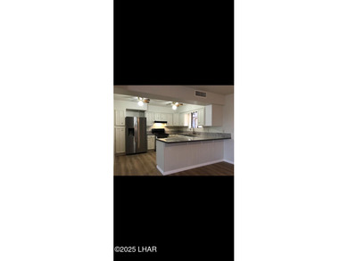 Tremendous opportunity in a terrific neighborhood! This unique on London Bridge Golf Course in Arizona - for sale on GolfHomes.com, golf home, golf lot