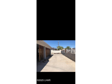 Tremendous opportunity in a terrific neighborhood! This unique on London Bridge Golf Course in Arizona - for sale on GolfHomes.com, golf home, golf lot