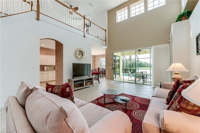 This stunning home features a spacious screened lanai with south on Shadow Wood Country Club in Florida - for sale on GolfHomes.com, golf home, golf lot