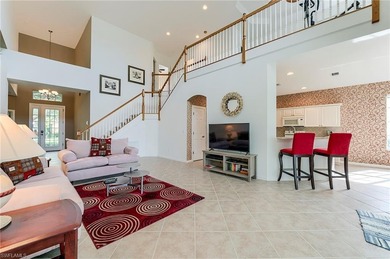 This stunning home features a spacious screened lanai with south on Shadow Wood Country Club in Florida - for sale on GolfHomes.com, golf home, golf lot