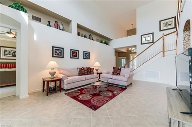 This stunning home features a spacious screened lanai with south on Shadow Wood Country Club in Florida - for sale on GolfHomes.com, golf home, golf lot