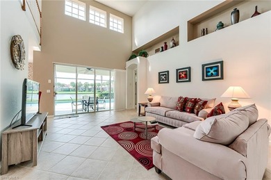 This stunning home features a spacious screened lanai with south on Shadow Wood Country Club in Florida - for sale on GolfHomes.com, golf home, golf lot