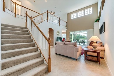 This stunning home features a spacious screened lanai with south on Shadow Wood Country Club in Florida - for sale on GolfHomes.com, golf home, golf lot