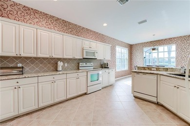 This stunning home features a spacious screened lanai with south on Shadow Wood Country Club in Florida - for sale on GolfHomes.com, golf home, golf lot