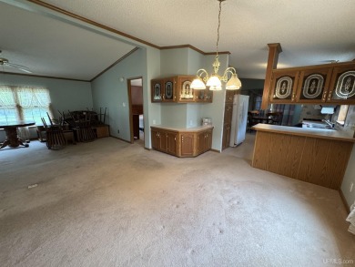 Welcome to this well-maintained 3-bedroom, 2-bath manufactured on Crystal View Municipal Golf Course in Michigan - for sale on GolfHomes.com, golf home, golf lot