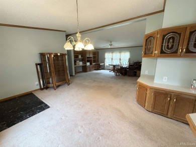 Welcome to this well-maintained 3-bedroom, 2-bath manufactured on Crystal View Municipal Golf Course in Michigan - for sale on GolfHomes.com, golf home, golf lot