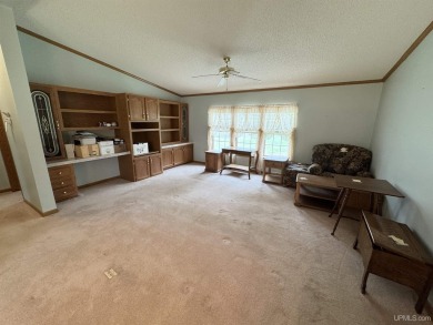 Welcome to this well-maintained 3-bedroom, 2-bath manufactured on Crystal View Municipal Golf Course in Michigan - for sale on GolfHomes.com, golf home, golf lot