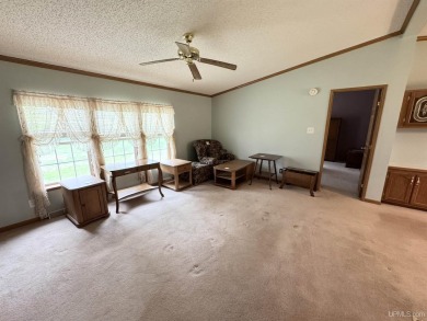 Welcome to this well-maintained 3-bedroom, 2-bath manufactured on Crystal View Municipal Golf Course in Michigan - for sale on GolfHomes.com, golf home, golf lot