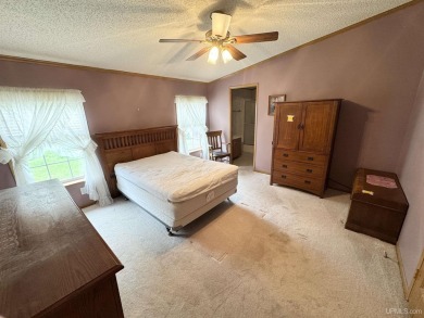 Welcome to this well-maintained 3-bedroom, 2-bath manufactured on Crystal View Municipal Golf Course in Michigan - for sale on GolfHomes.com, golf home, golf lot